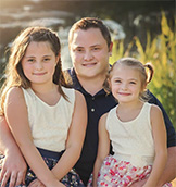 Derek Messner, senior designer of IDU Creative design studio (and his daughters)